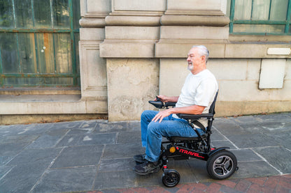 Metro Mobility iTravel Plus Electric Wheelchair - left side lifestyle view with model