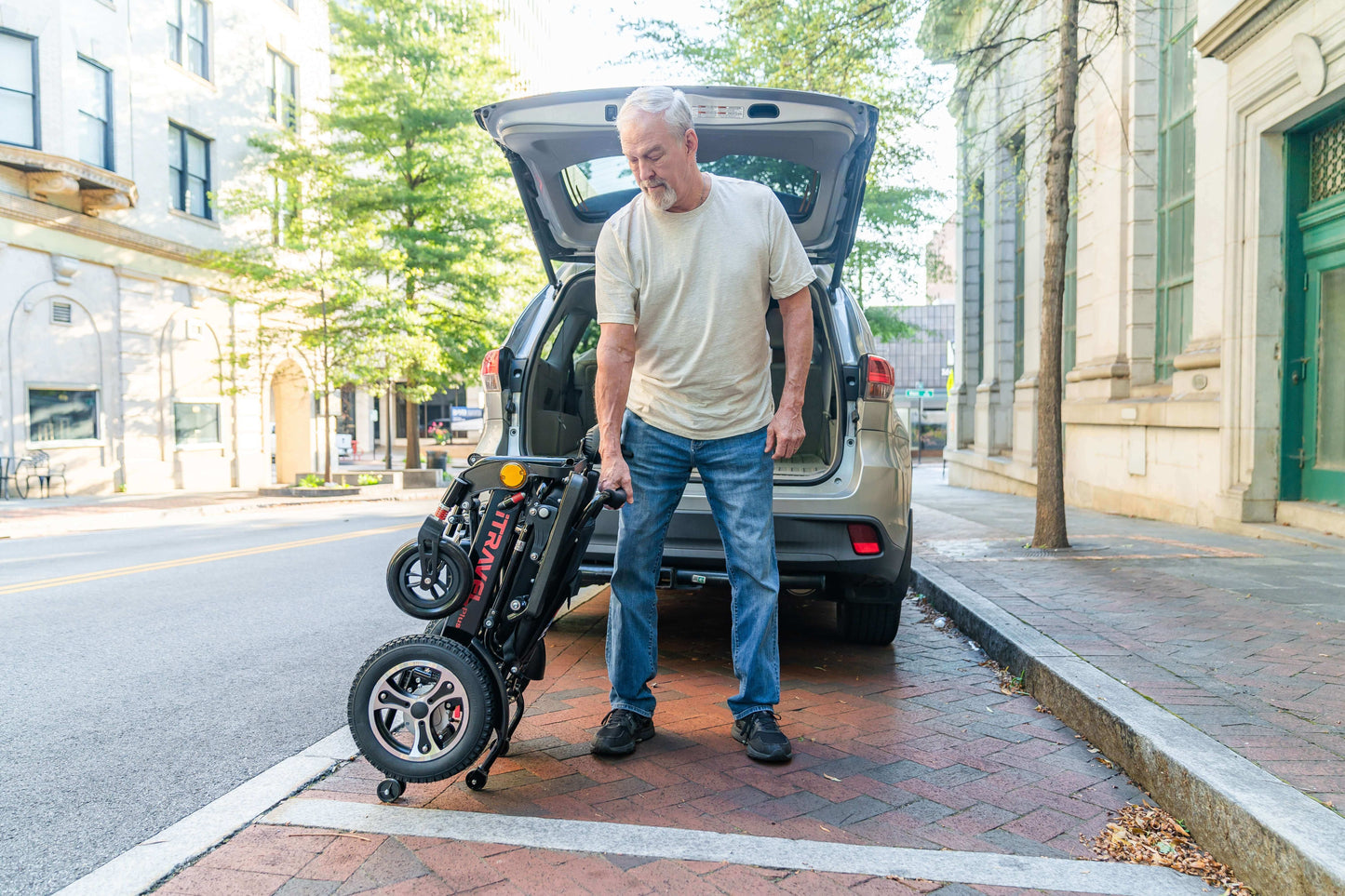 Metro Mobility iTravel Plus Electric Wheelchair - folded view vehicle trunk with model