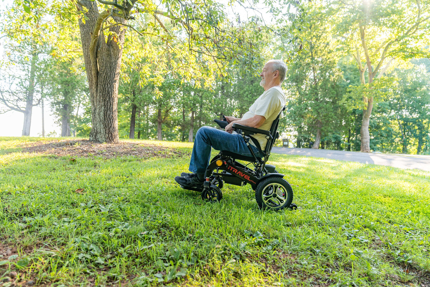 Metro Mobility iTravel Plus Electric Wheelchair - left side lifestyle view with model